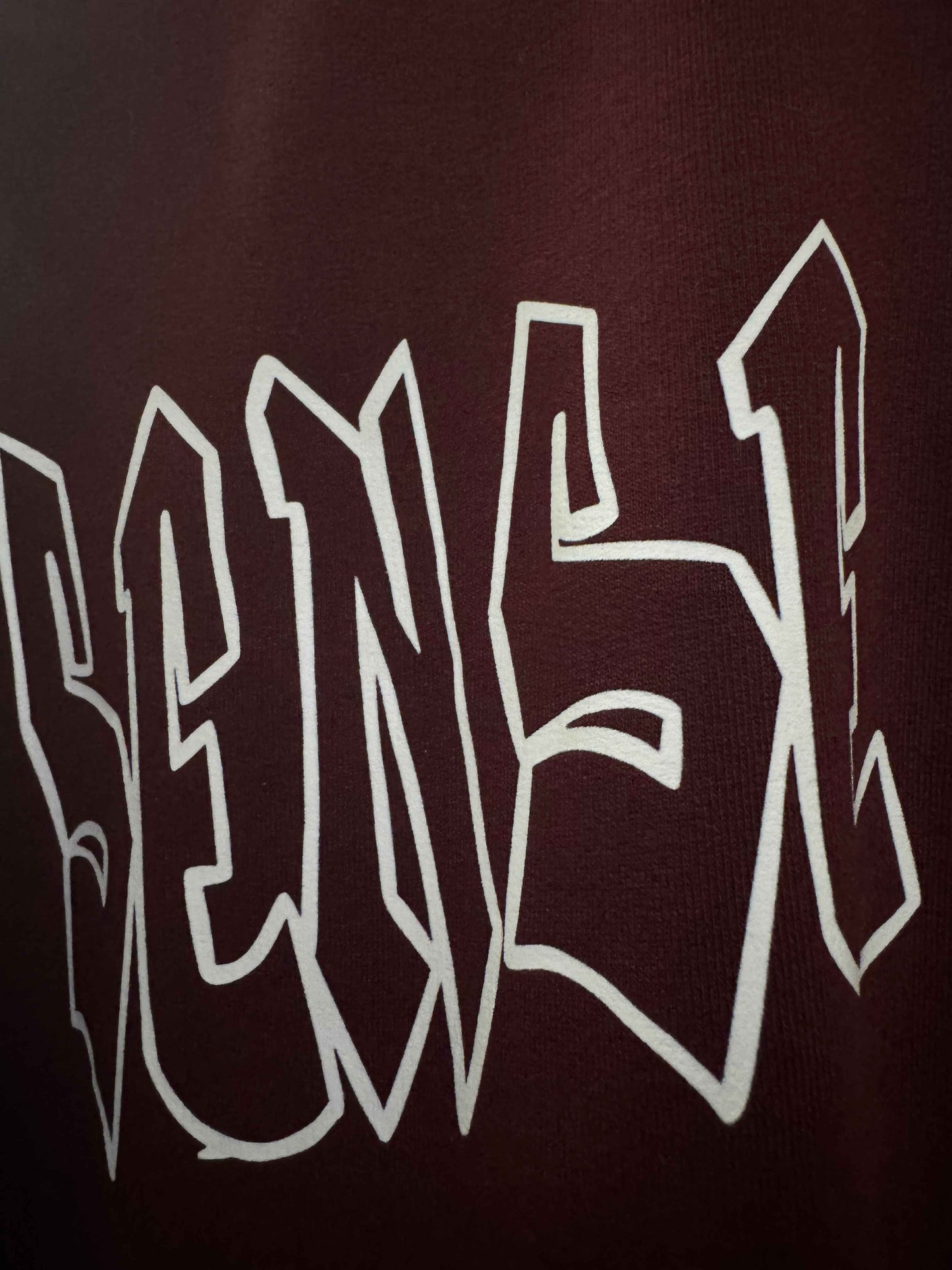 Close-up of maroon 240 GSM French Terry cotton fabric quality – Sense of Street basics.