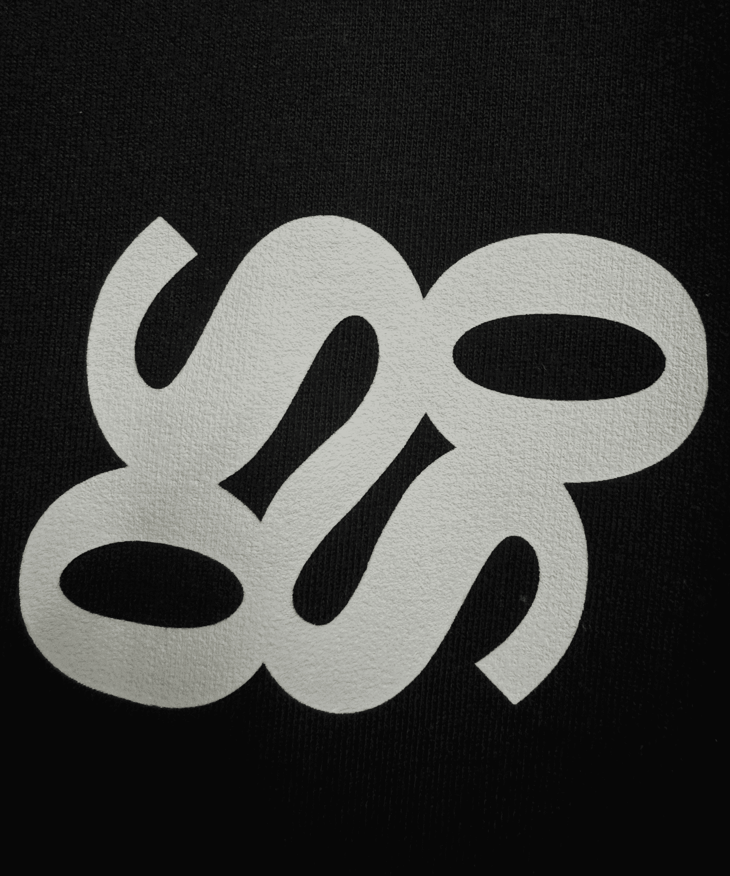 Close-up of black 240 GSM French Terry cotton fabric and print quality – Sense of Street India.