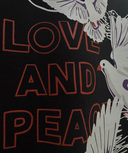 Detailed texture shot of 240 GSM French Terry cotton fabric on the Love and Peace oversized streetwear tee.