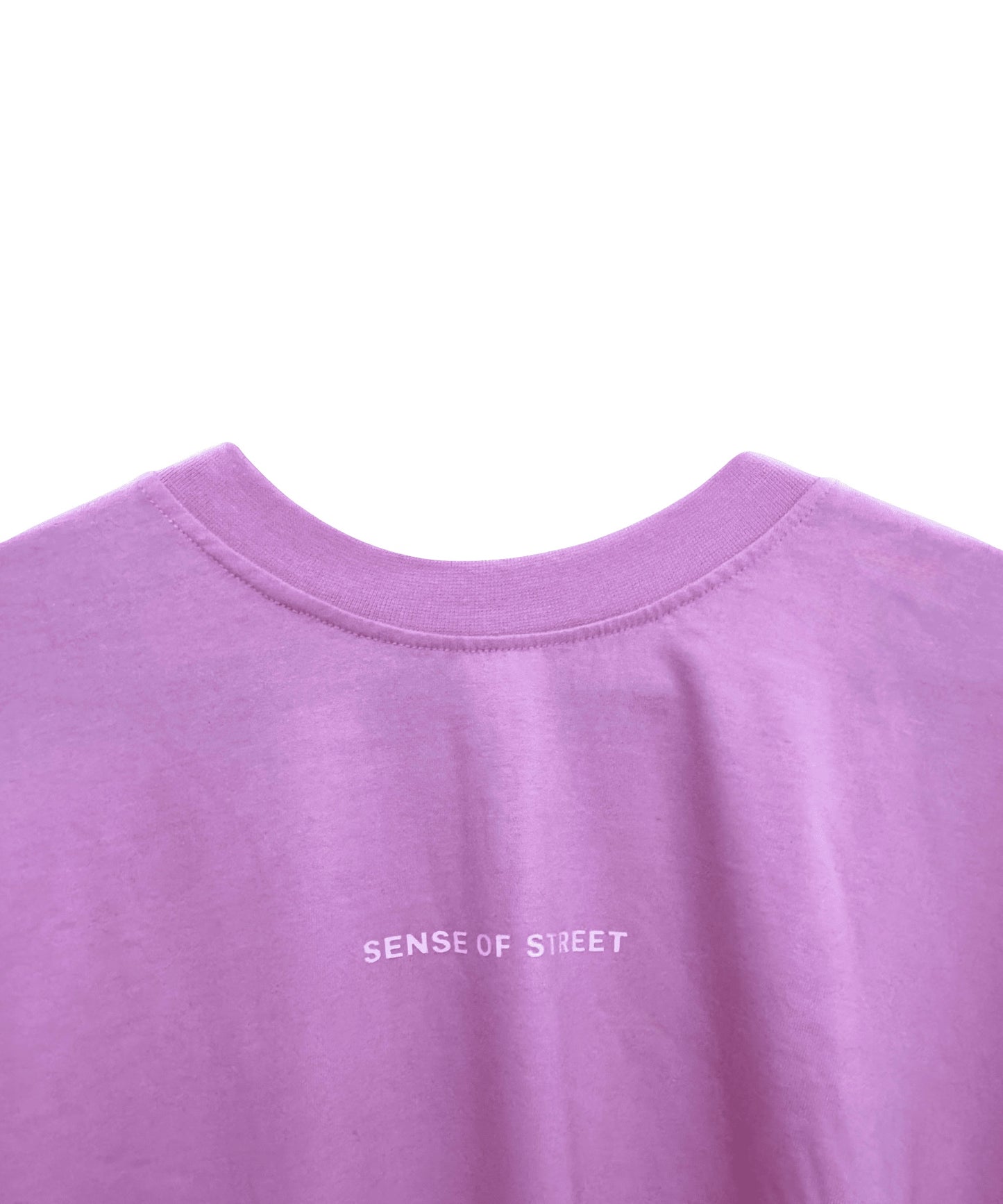 Detailed view of Against The World premium screen print on pink fabric - Sense of Street