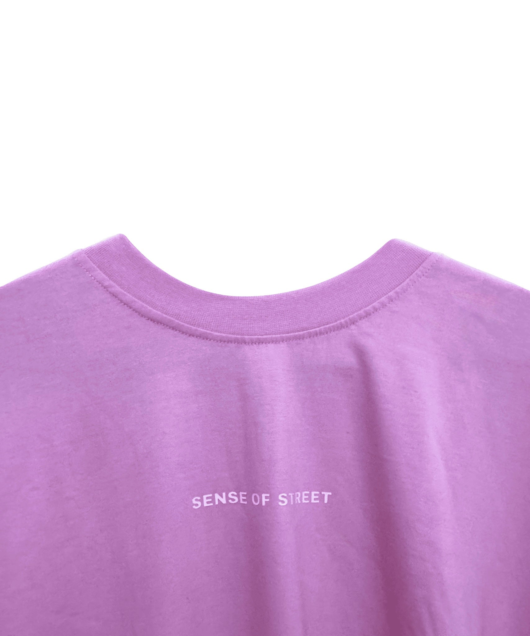 Detailed view of Against The World premium screen print on pink fabric - Sense of Street