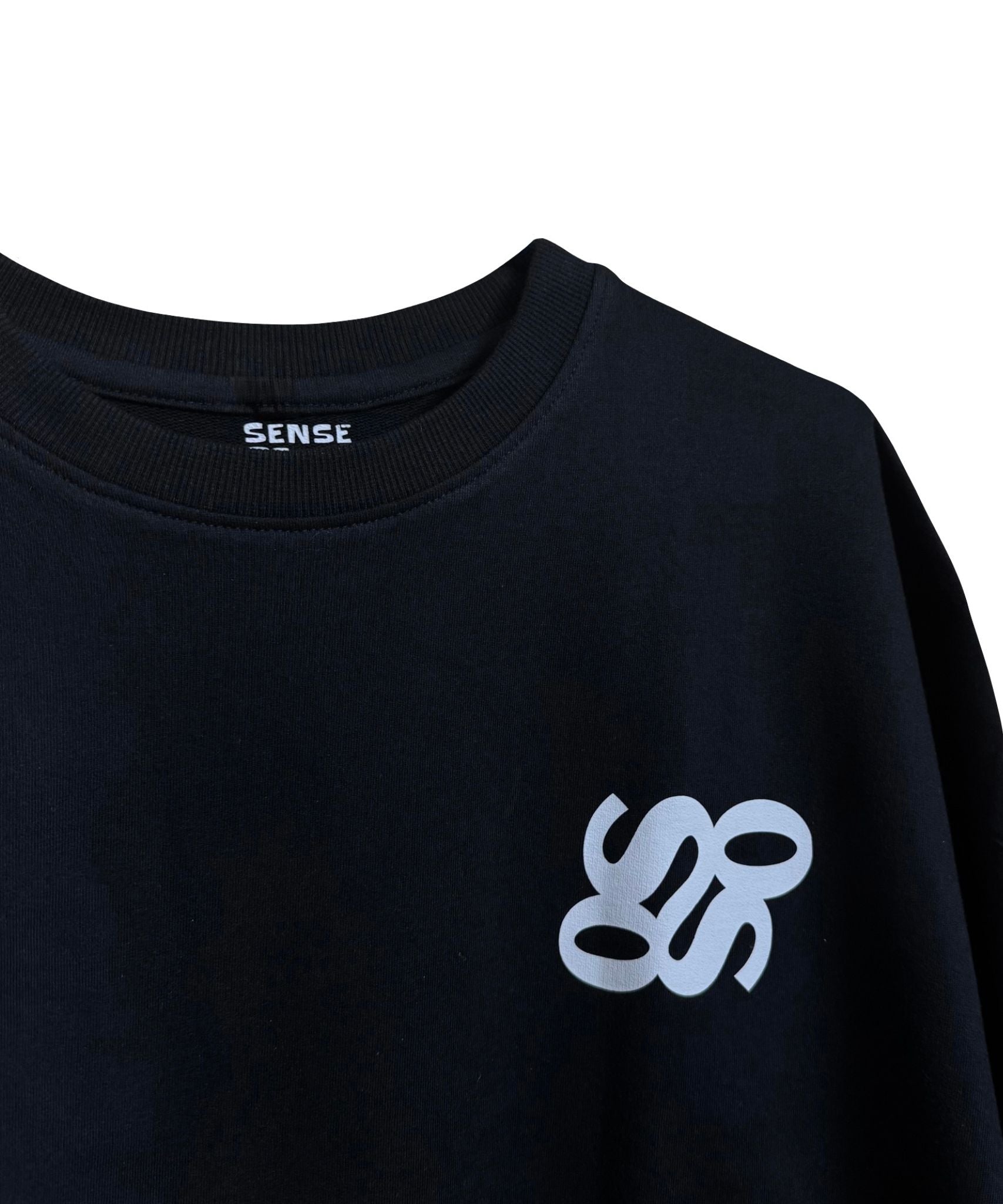 Black oversized t-shirt front view with subtle SOS logo – Premium 240 GSM streetwear basic.
