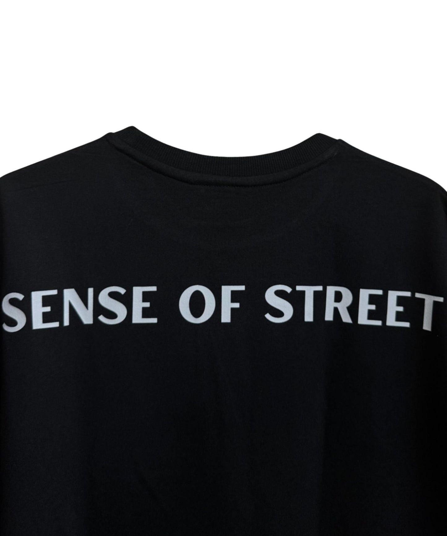 Back view of black basic t-shirt with bold Sense of Street text branding – Heavyweight cotton tee.