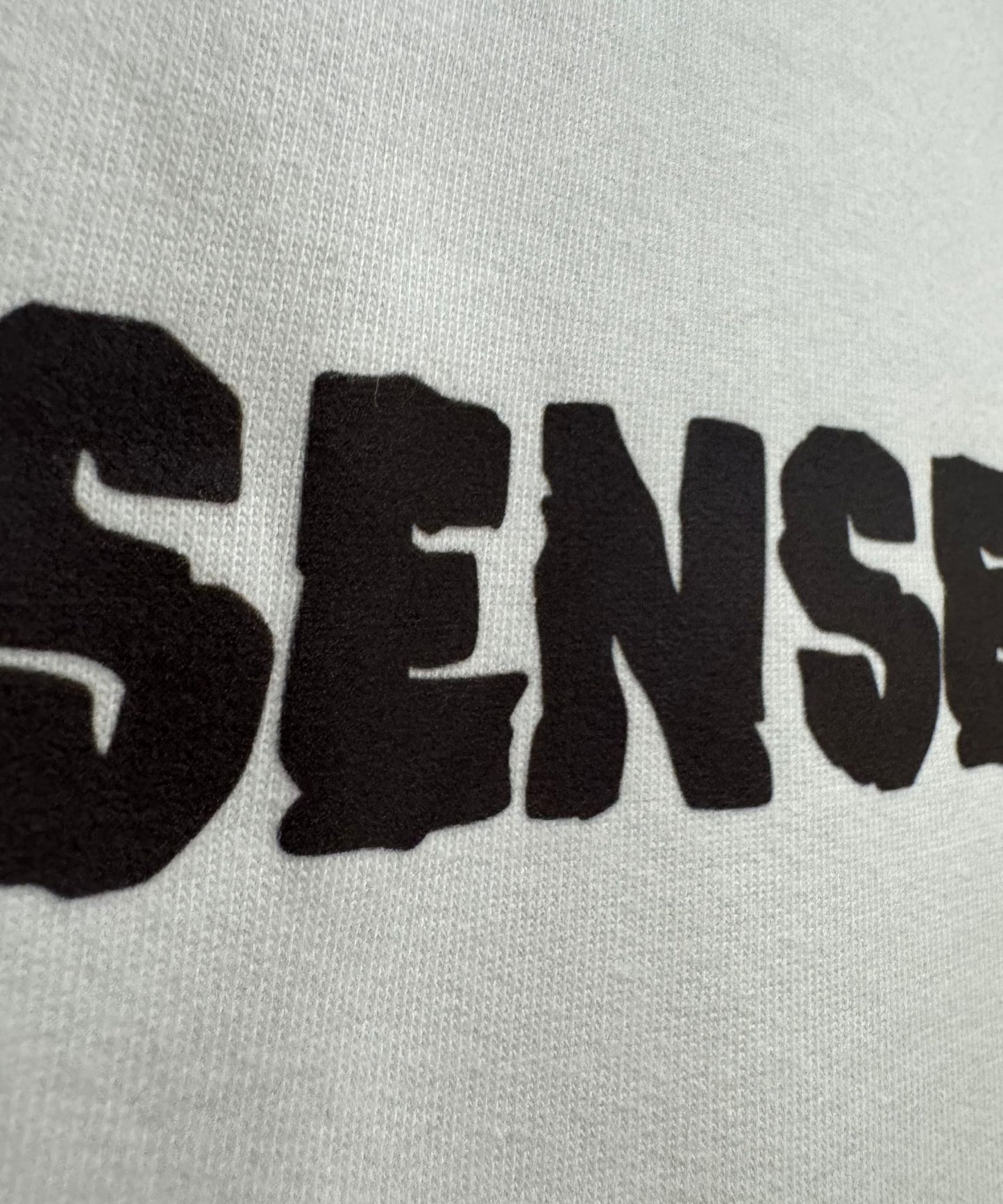 Close-up of premium 240 GSM French Terry cotton texture and high-definition art print – Faces of the Street.