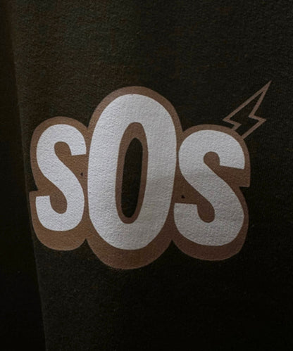 Close-up detail of Money Talks graphic print quality and 240 GSM moss green fabric texture – Sense of Street.